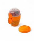 BananaHere Happy Cup 500 ml orange snack container with attached fork-spoon, filled with berries and crackers.
شوكه و معلقه ، علبه سناكس ، كب زبادى
علبه سلطه ، علبة ثلاجه