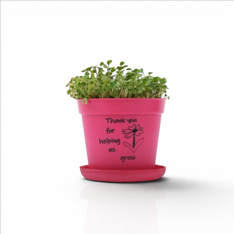 Banana Kids’ Eco-Friendly Gardening Kit in pink recycled PP material with "Thank you for helping us grow" text and a flower graphic.