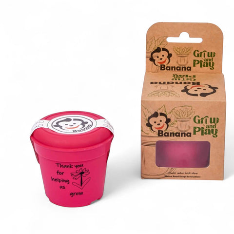 Banana Kids’ Eco-Friendly Gardening Kit in pink recycled PP material with pot, drip tray, soil, and seeds.