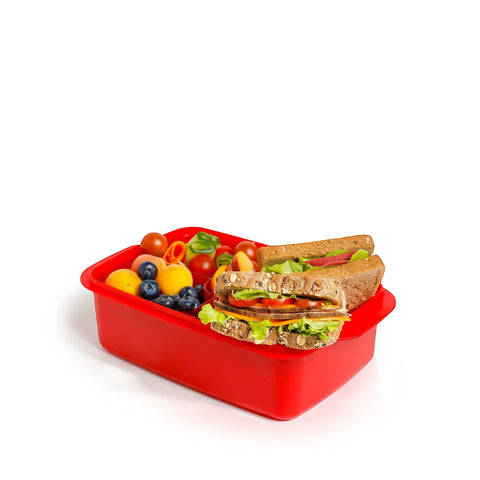 Banana 1.5L red lunch box with removable splitter filled with sandwiches, blueberries, and cherry tomatoes.