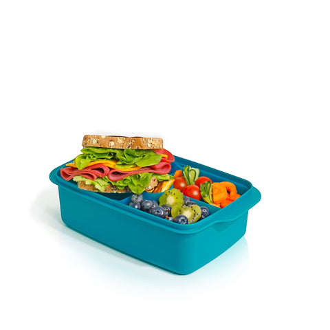 Banana 1.5L teal lunch box with removable splitter filled with a sandwich, blueberries, kiwi, cherry tomatoes, and carrots.