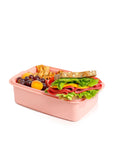 Banana lunch box 1.5L in pink, made of PP material, with removable splitter, steam vent, and a sandwich, fruits, and snacks.